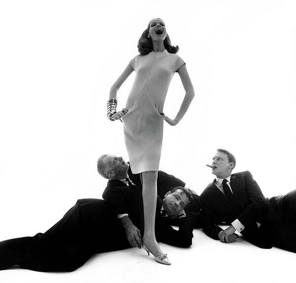 #new2022vogue Art Print featuring the photograph Veruschka With Three Actors At Her Feet by Bert Stern