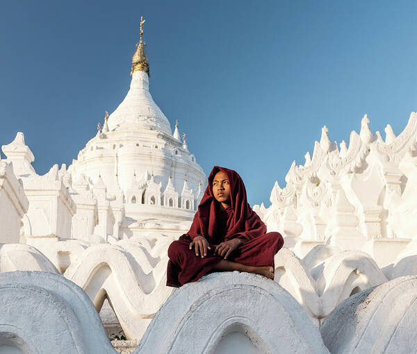 Pagoda Art Print featuring the photograph Young Buddhist Monk Sitting On Temple by Martin Puddy