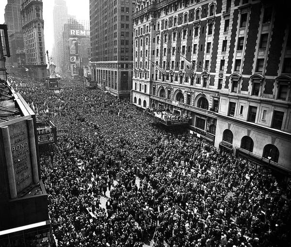Europe Art Print featuring the photograph Huge crowd gathered in Times Square to celebrate VE-Day, the end of WWII in Europe. by Herbert Gehr