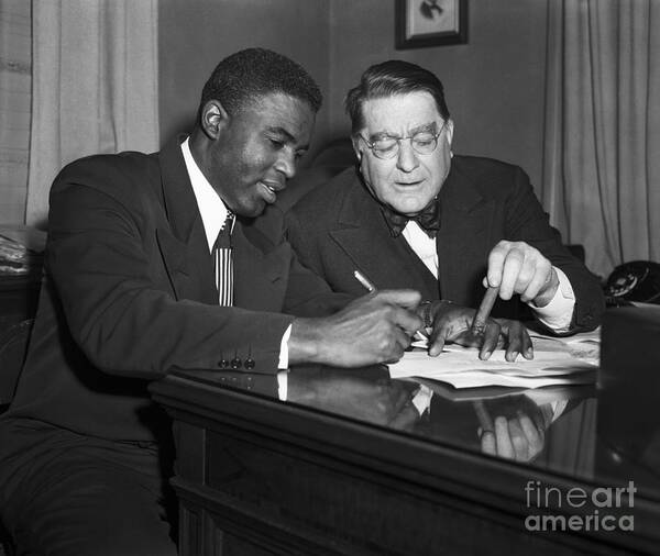 Mature Adult Art Print featuring the photograph Jackie Robinson Signing Contract by Bettmann