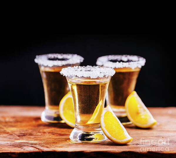 Tequila Art Print featuring the photograph Tree shot glasses of Mexican tequila cocktail with lemon slices by Jelena Jovanovic