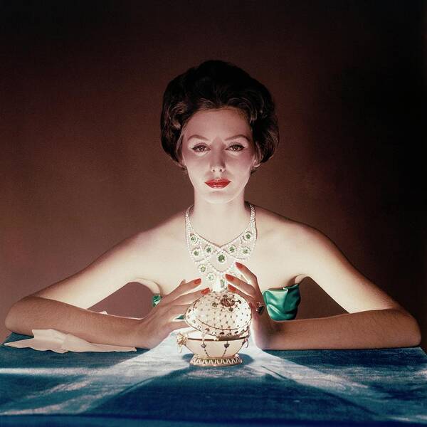 Beauty Art Print featuring the photograph A Model Illuminated By A Faberge Egg by John Rawlings