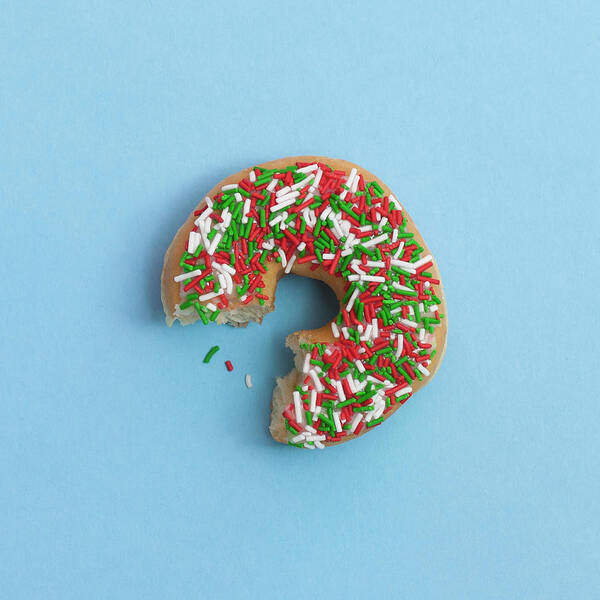 Unhealthy Eating Art Print featuring the photograph Bite Out Of A Sprinkle Donut, On A Blue by Steven Errico
