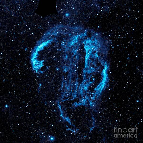 Wispy Tendrils Of Hot Dust And Gas Glow Brightly In This Ultraviolet Image Of The Cygnus Loop Nebula Art Print featuring the photograph Cygnus Loop Nebula by Paul Fearn