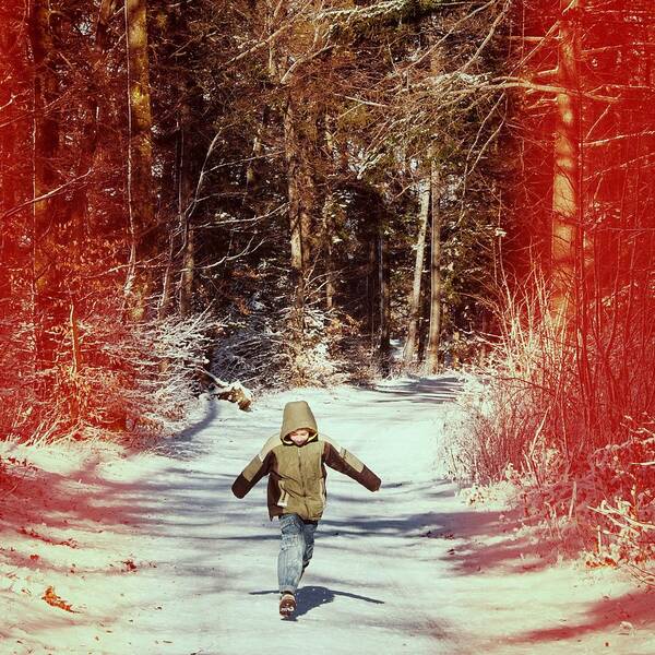 Boy Art Print featuring the photograph Happy young boy running in the winterly forest by Matthias Hauser