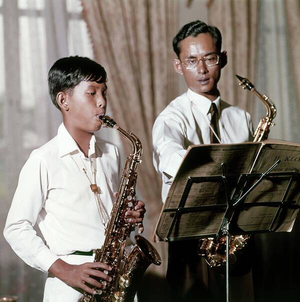 Royalty Art Print featuring the photograph King Bhumibol And Prince Vajirlongkorn Playing by Henry Clarke