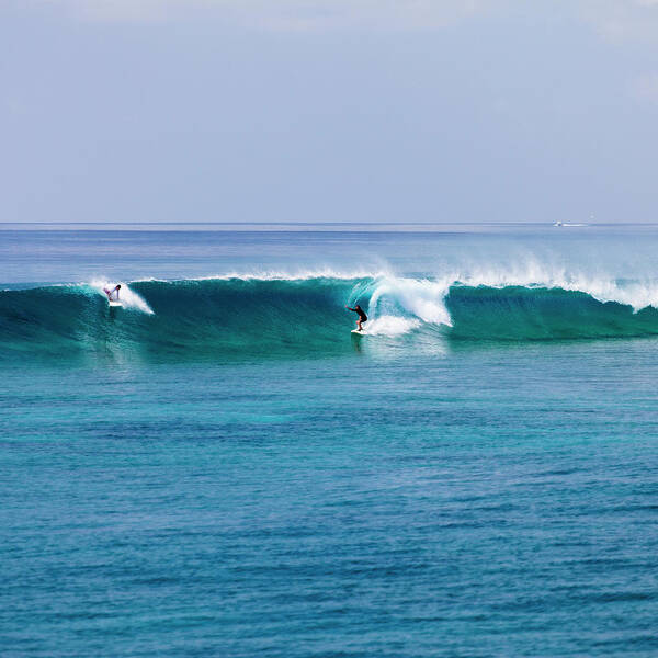 Recreational Pursuit Art Print featuring the photograph Surfers Surfing A Wave by Subman