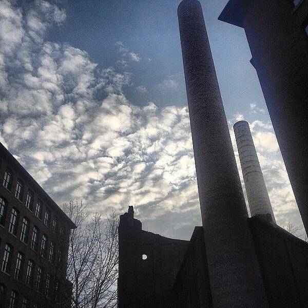  Art Print featuring the photograph Towering Chimneys Of Old Renovated Mill by Raam Dev