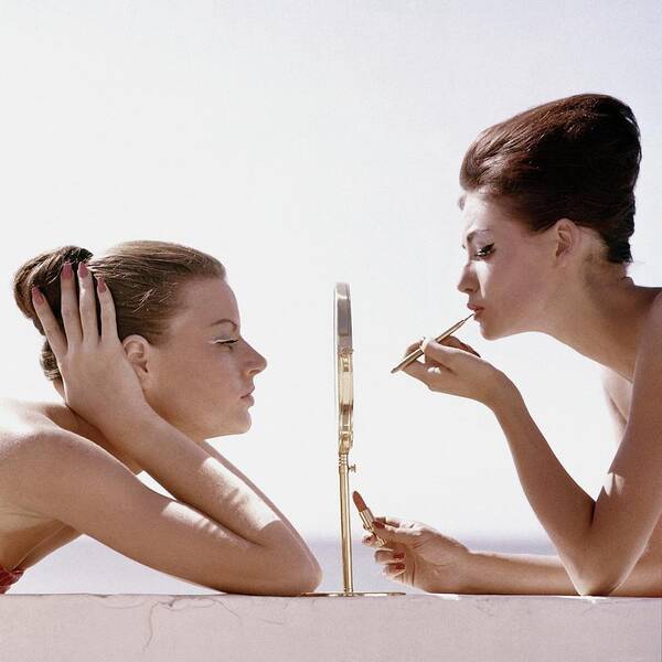 Beauty Studio Shot Two People People Mirror Reflection Applying Lipstick Make-up Cosmetics Max Factor White Background Leaning Lip Brush 20-24 Years Young Adult 20s Adult Female Young Woman Young Adult Woman #condenastvoguephotograph April 1st 1960 Art Print featuring the photograph Women With A Mirror by Leombruno-Bodi