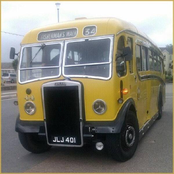 Coach Art Print featuring the photograph #old #yellow #bus #exmouth #seafront by Kevin Zoller