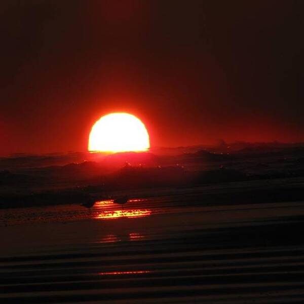 Sun Art Print featuring the photograph Sunset in the Waves by Laura Henry