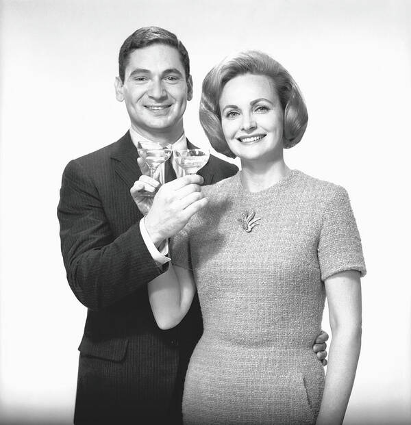 Heterosexual Couple Art Print featuring the photograph Couple Toasting Champagne In Studio by George Marks