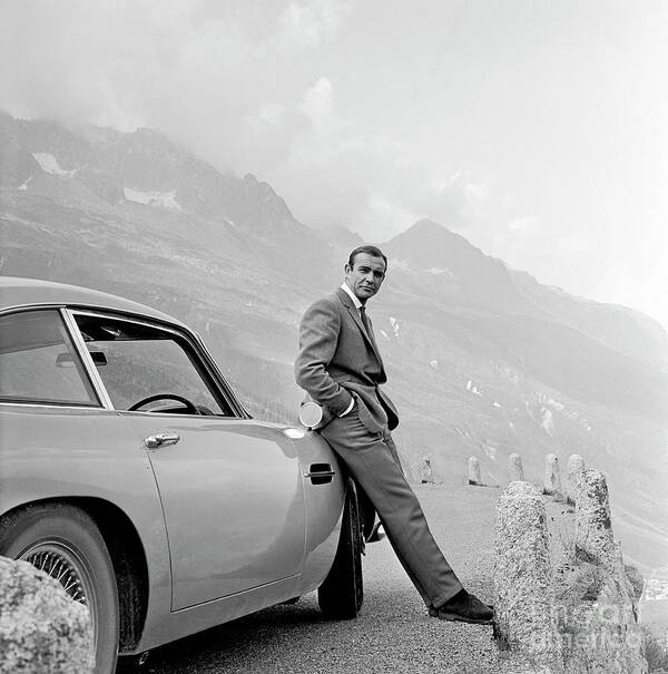 James Bond Art Print featuring the photograph James Bond Coolly Leaning on His Aston Martin by Doc Braham