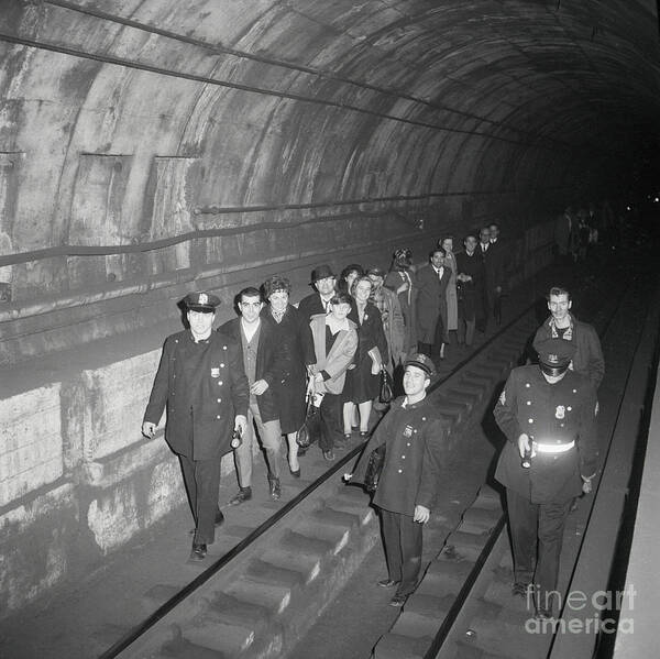 People Art Print featuring the photograph Passengers Being Lead Through Subway by Bettmann
