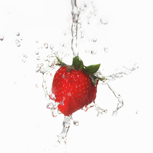 White Background Art Print featuring the photograph Water Splashing On Strawberry by Annabelle Breakey