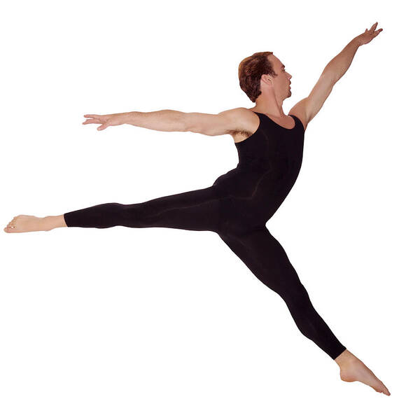 Ballet Dancer Art Print featuring the photograph A male ballet dancer does a grand jete? in an arabasque position, side view., by Thinkstock