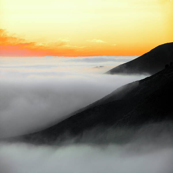 Fog Hugging The Coast Art Print featuring the photograph Fog hugging coast at sunset by Donald Kinney