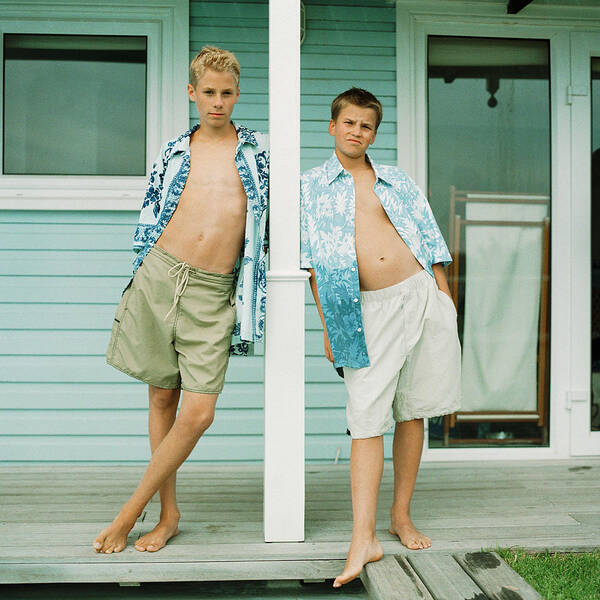Cool Attitude Art Print featuring the photograph Two teenage boys standing in front of house by Patrick Sheandell O'Carroll