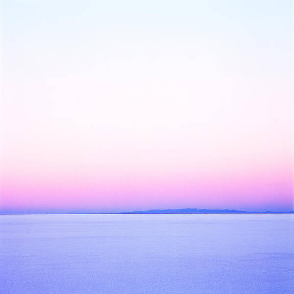 Sparse Art Print featuring the photograph White Pink And Blue Sunset On The Salt Flats Of Utah by Digital Vision