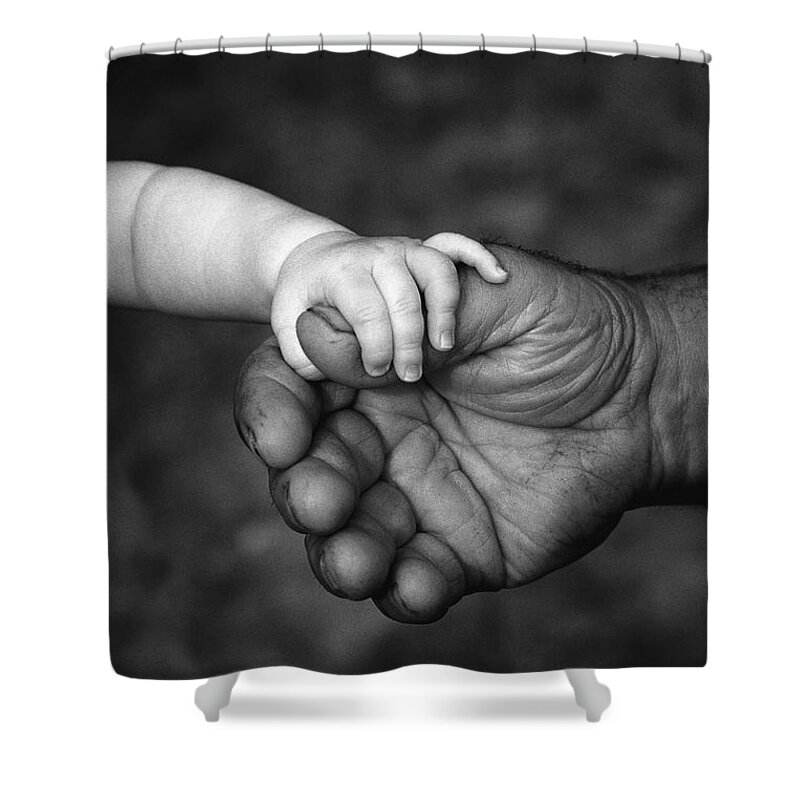 Weak And Strong Shower Curtain featuring the photograph Babys Hand Holding On To Adult Hand #1 by Corey Hochachka