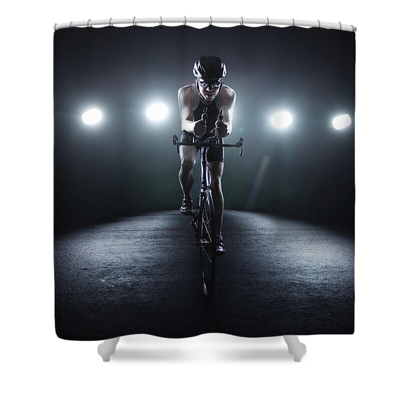Helmet Shower Curtain featuring the photograph Cyclist Riding At Night In The City #1 by Stanislaw Pytel