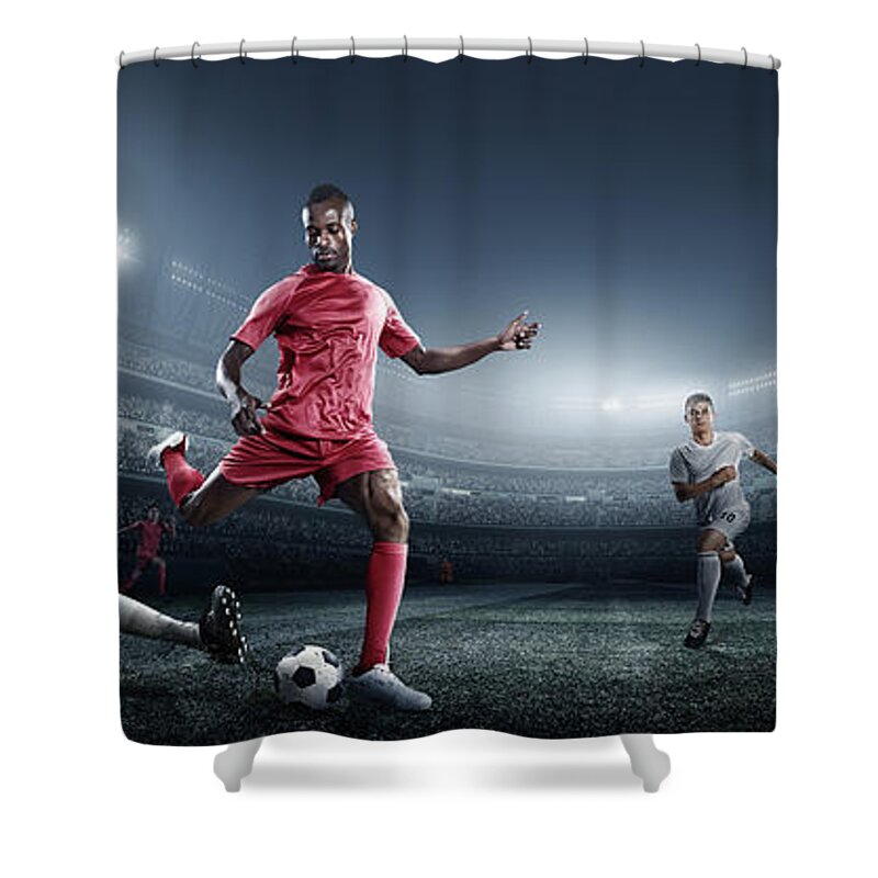 Soccer Uniform Shower Curtain featuring the photograph Soccer Player Kicking Ball In Stadium #1 by Dmytro Aksonov