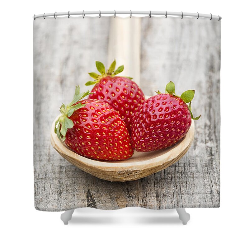 Berry Shower Curtain featuring the photograph Strawberries in a wooden spoon #1 by Paulo Goncalves