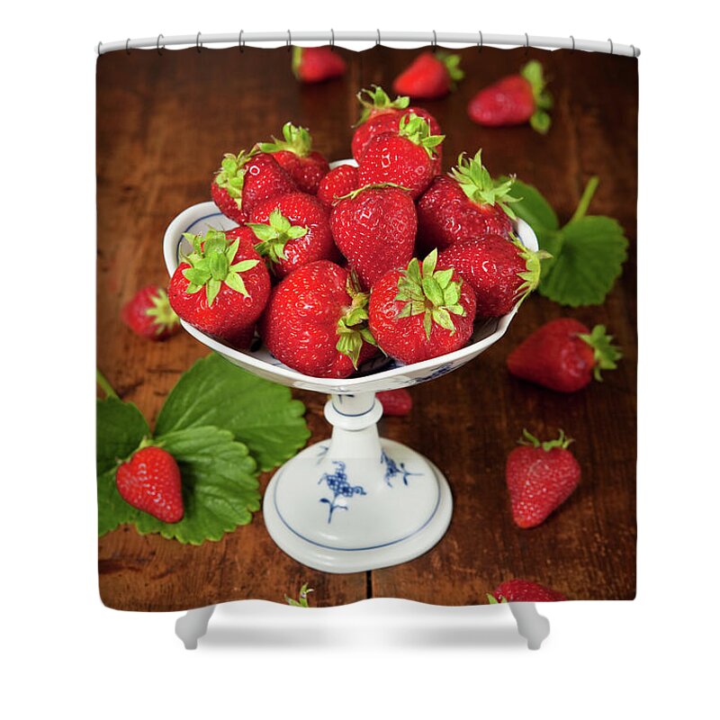 Crockery Shower Curtain featuring the photograph A Dish Of Fresh Strawberries On A by Ursula Alter