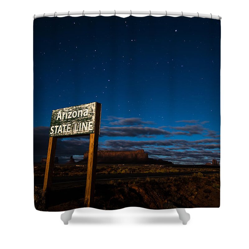 Arizona Shower Curtain featuring the photograph Arizona State Line in Monument Valley at Night by Todd Aaron