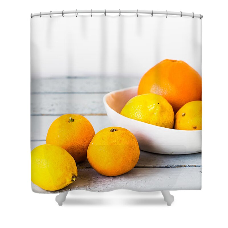 Citrus Fruit Shower Curtain featuring the photograph Assorted Citrus Fruits by Philippe Garo