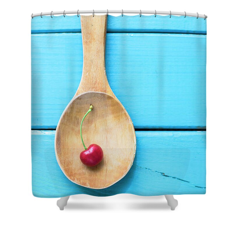 Cherry Shower Curtain featuring the photograph Cherry In A Wooden Spoon by C.aranega