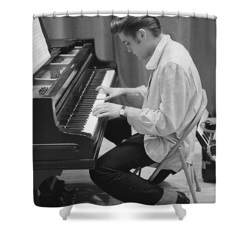 Elvis Presley Shower Curtain featuring the photograph Elvis Presley on piano while waiting for a show to start 1956 by The Harrington Collection