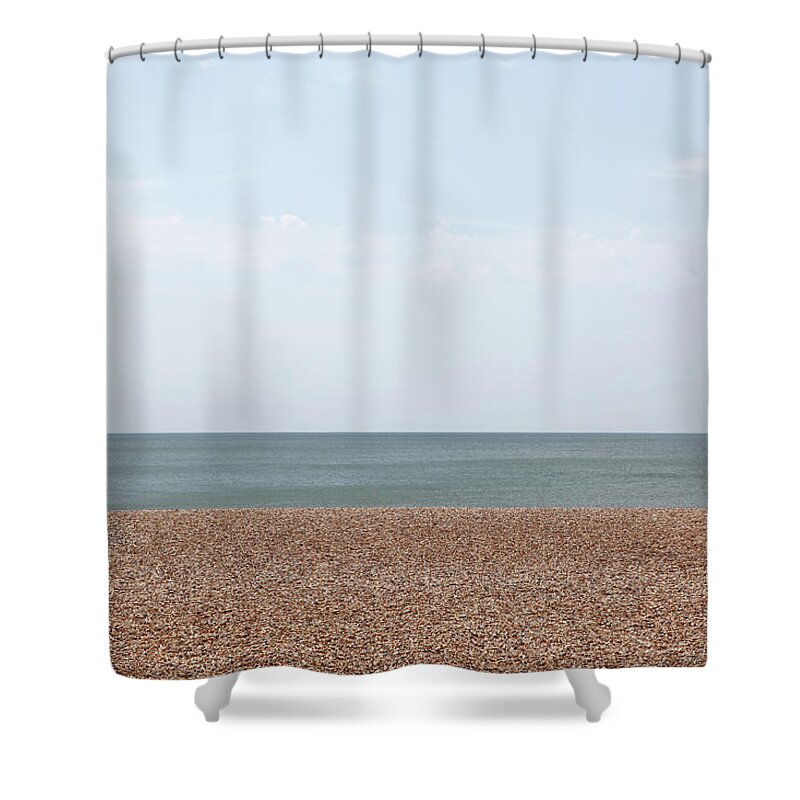 Tranquility Shower Curtain featuring the photograph Empty Pebble Beach by Richard Newstead
