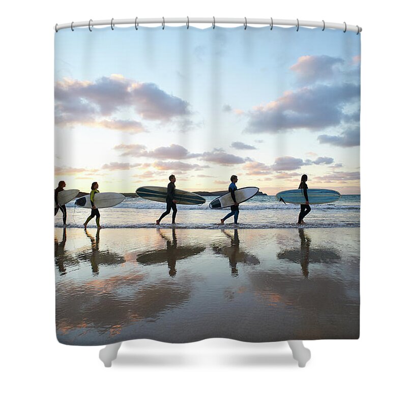 Summer Shower Curtain featuring the photograph Five Surfers Walk Along Beach With Surf by Dougal Waters