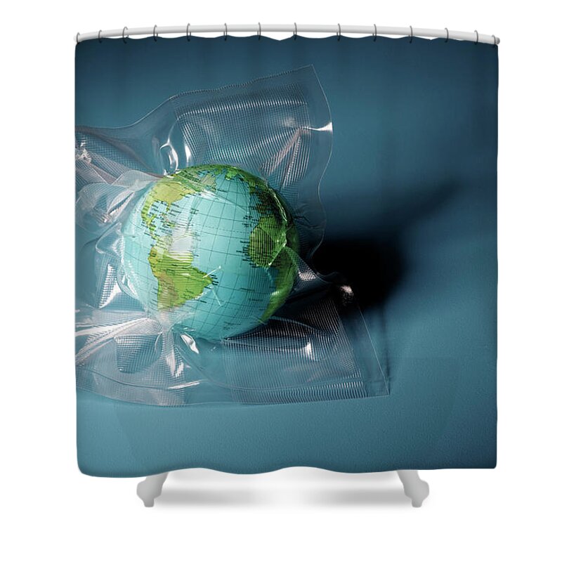 Environmental Conservation Shower Curtain featuring the photograph Globe Shrink Wrapped In Plastic by Henrik Weis