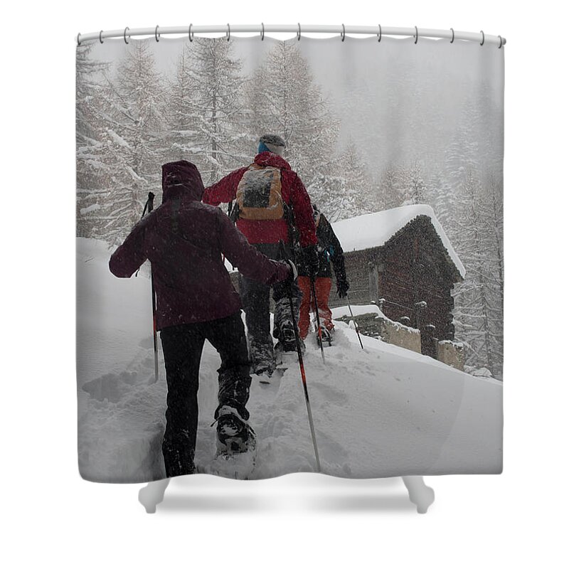 Mature Adult Shower Curtain featuring the photograph Group Of People In A Snowy Forest by Buena Vista Images
