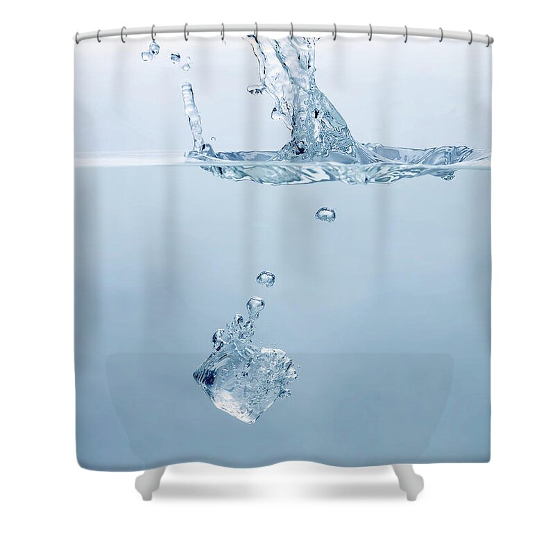 Ice Cube Shower Curtain featuring the photograph Ice Cube Splashing Into Water by Ballyscanlon