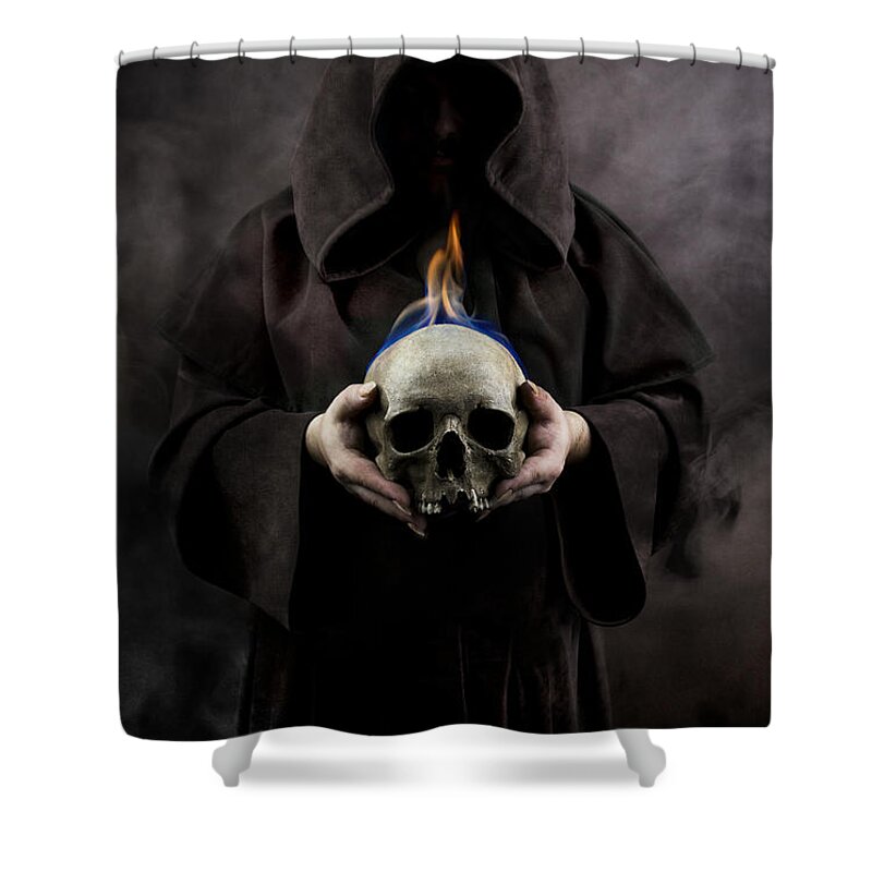 Hood Shower Curtain featuring the photograph Man in the hooded cloak holding burning human skull in his hand by Jaroslaw Blaminsky