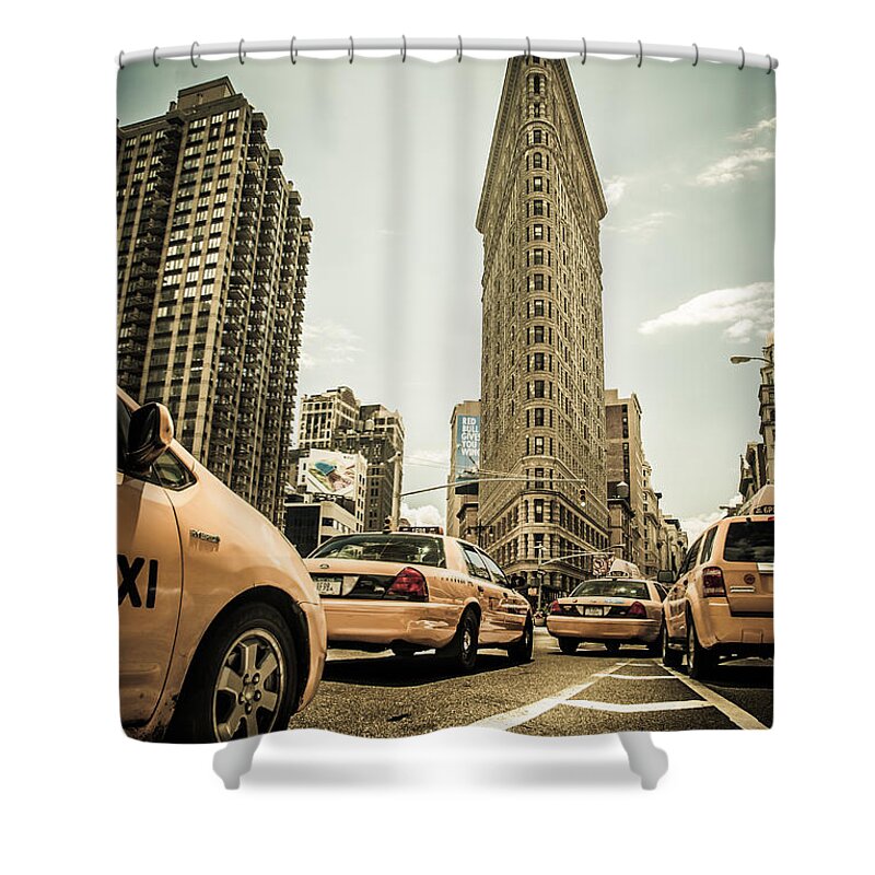 Nyc Shower Curtain featuring the photograph NYC Yellow cabs at the flat iron building - V1 by Hannes Cmarits