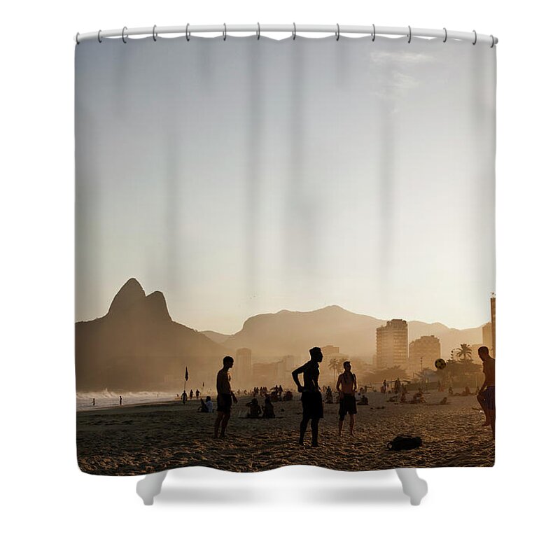 Young Men Shower Curtain featuring the photograph Playing Soccer At Sunset On Ipanema by Cultura Rm Exclusive/jag Images