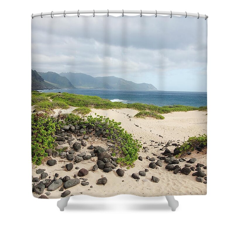 Honolulu Shower Curtain featuring the photograph Rocks And Greenery In The Sand Leading by Brandon Tabiolo / Design Pics