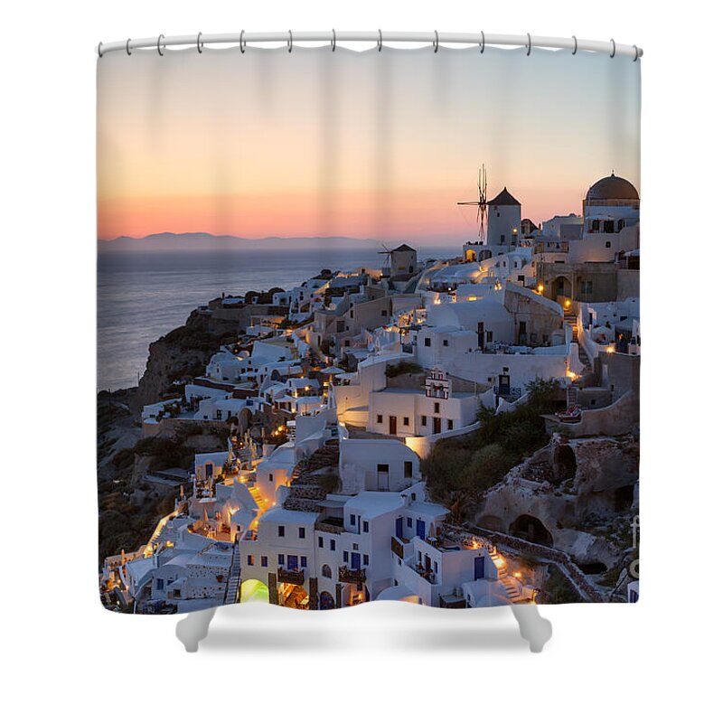 Greece Shower Curtain featuring the photograph Romantic sunset over the village of Oia Greece Santorini by Matteo Colombo