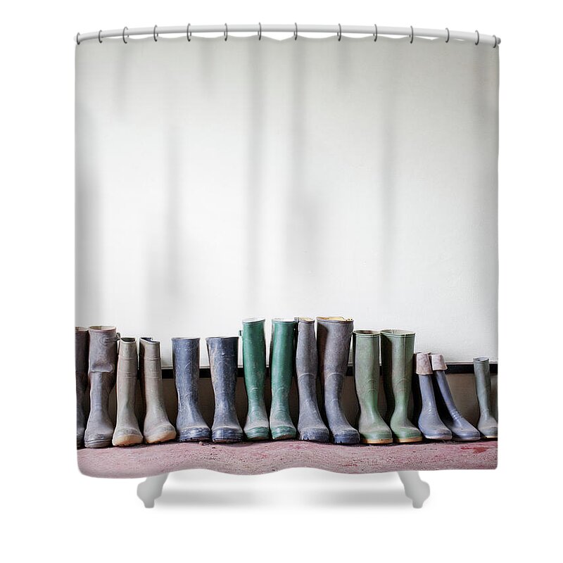 Rubber Boots In A Row Shower Curtain by Ian Nolan 