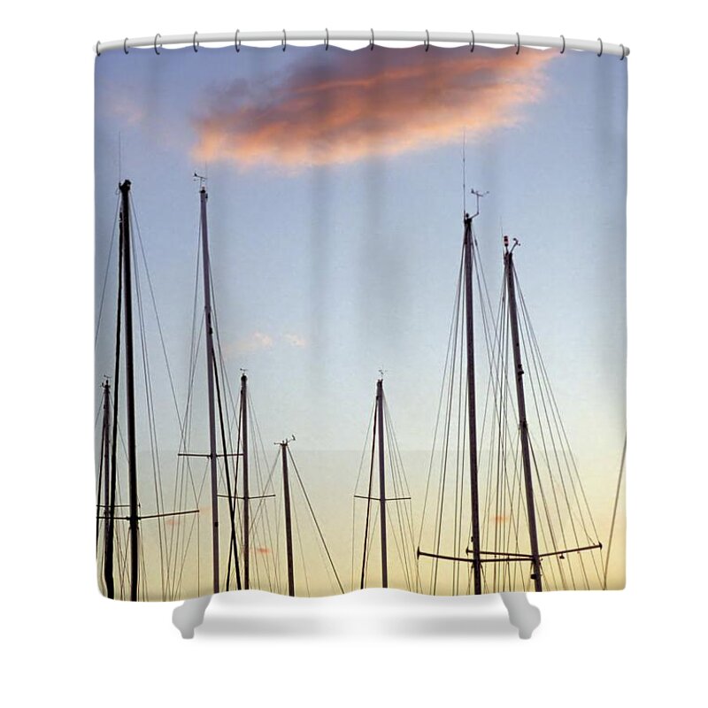 Sailboat Masts Shower Curtain featuring the photograph A Forest of Sailboat Masts Silhouetted by a setting Sun by John Harmon