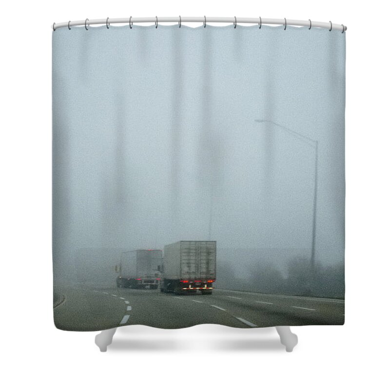Road; Roadway; Highway; Interstate; Lanes; Day; Daytime; Lines; Fog; Foggy; Black; Asphalt; Cement; Shroud; Truck; Semi; Trailer; Transportation; Transport; Two; Back; Taillights; Lights; Curve; Bend; Street Lights Shower Curtain featuring the photograph Semis by Margie Hurwich