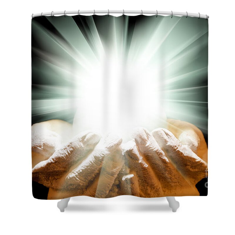 Spiritual Shower Curtain featuring the photograph Spiritual light in cupped hands on a black background by Simon Bratt