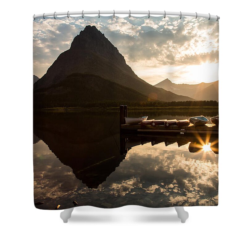 Reflection Shower Curtain featuring the photograph Swiftcurrent Lake Boats Reflection and Flare by John Daly