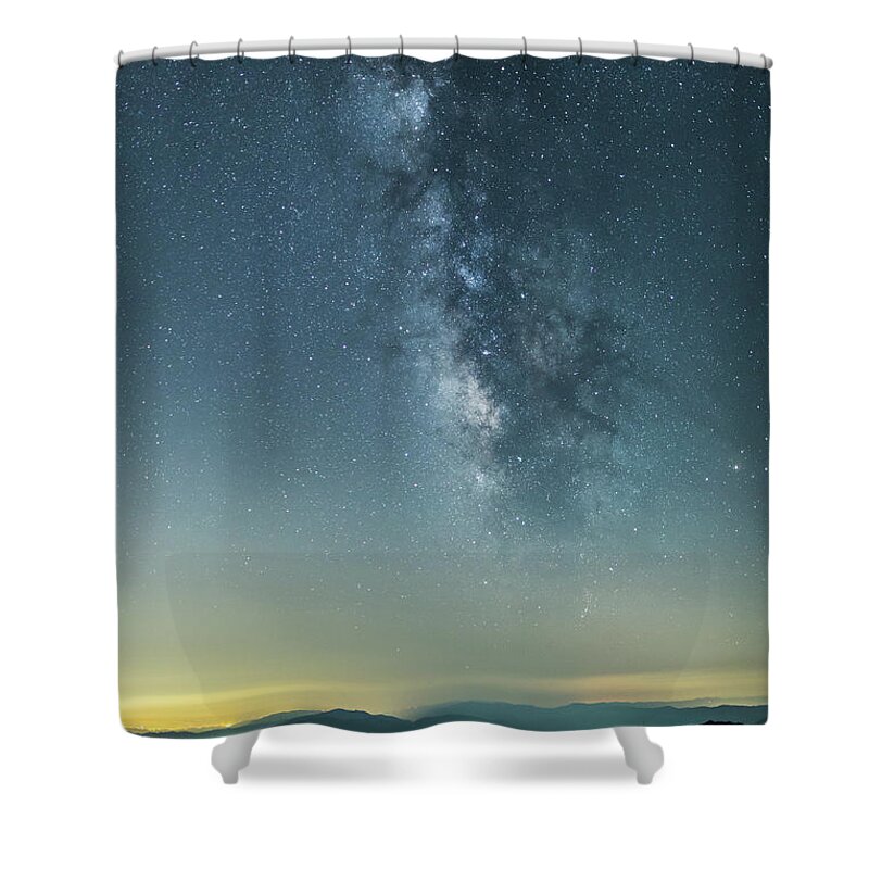 Scenics Shower Curtain featuring the photograph The Milky Way Hovering Above A Town by Trevor Williams