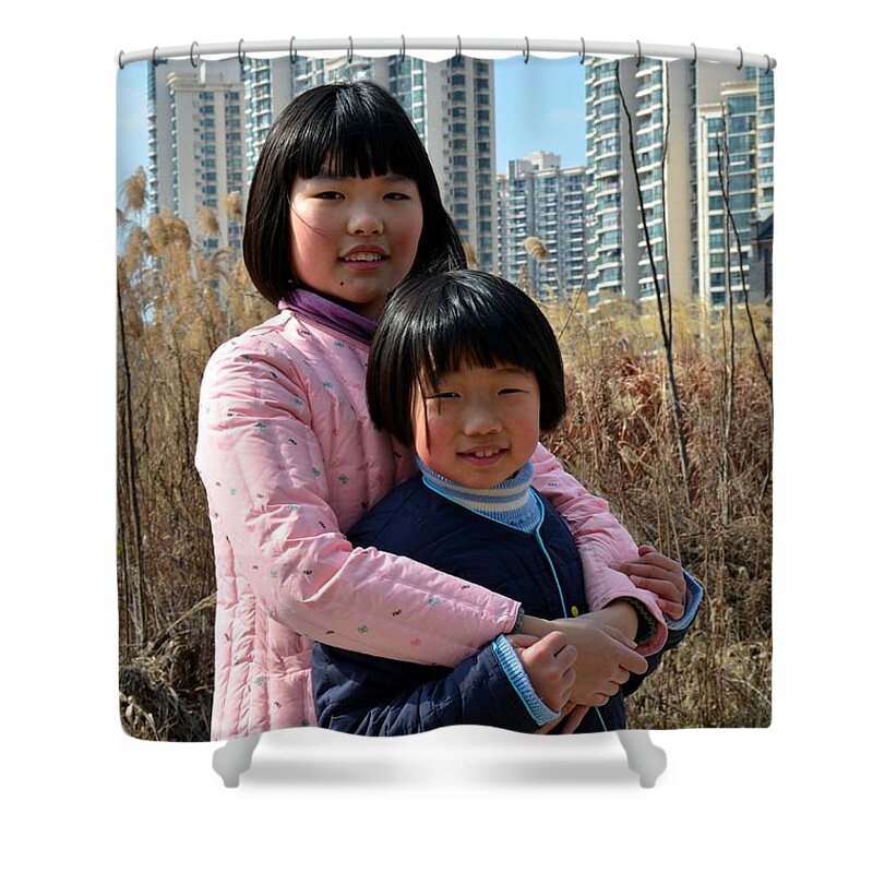 Girls Shower Curtain featuring the photograph Two Chinese teen sisters hug and embrace Shanghai China by Imran Ahmed