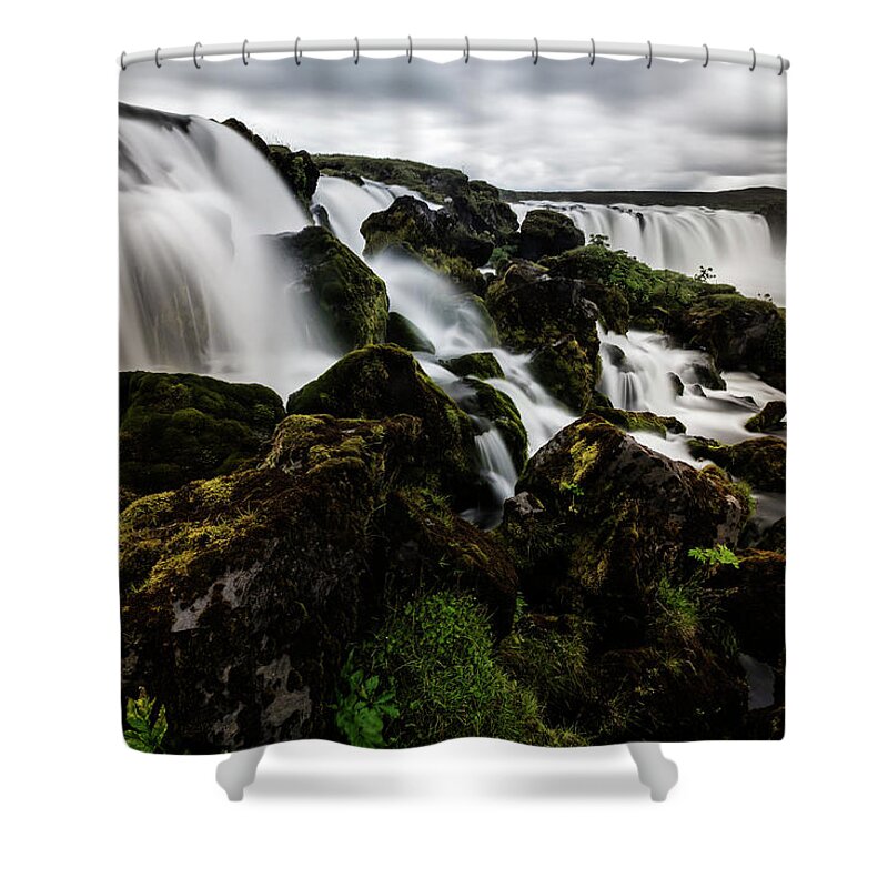 Toughness Shower Curtain featuring the photograph Waterfall Pouring Over Rock Formations by Pixelchrome Inc